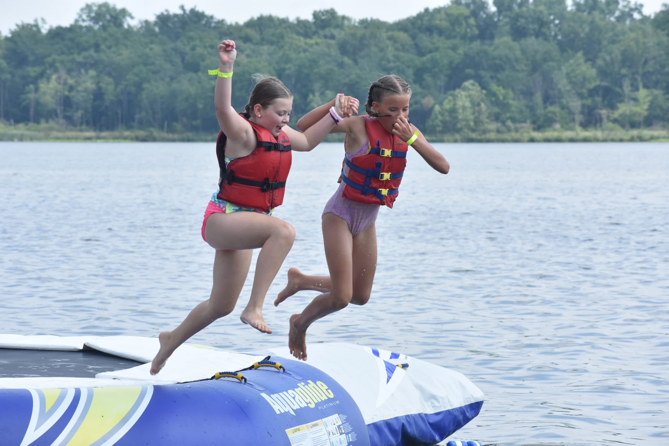 Campers jumping into Bear Lake